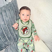 Ynfante Jeanner E joined the competition — help win amazing prizes! baby, beaver, bib, blanket, blue_eyes, camouflage, cartoon, child, couch, cozy, fabric, hand, indoor, infant, onesie, pillow, portrait, sitting, smile, sofa