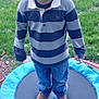 Jewlz joined the competition — help win amazing prizes! child, boy, outdoor, backyard, trampoline, grass, house, blue, sweater, jeans, shoes, curly_hair, serious_expression, play, fence, daylight, person, standing, casual_clothing, young