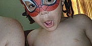 Jewlz joined the competition — help win amazing prizes! child, mask, spiderman_mask, braided_hair, indoors, curtains, shirtless, face, expression, person, playful, young, portrait, home, light, window, surprised, skin, shoulder, adult