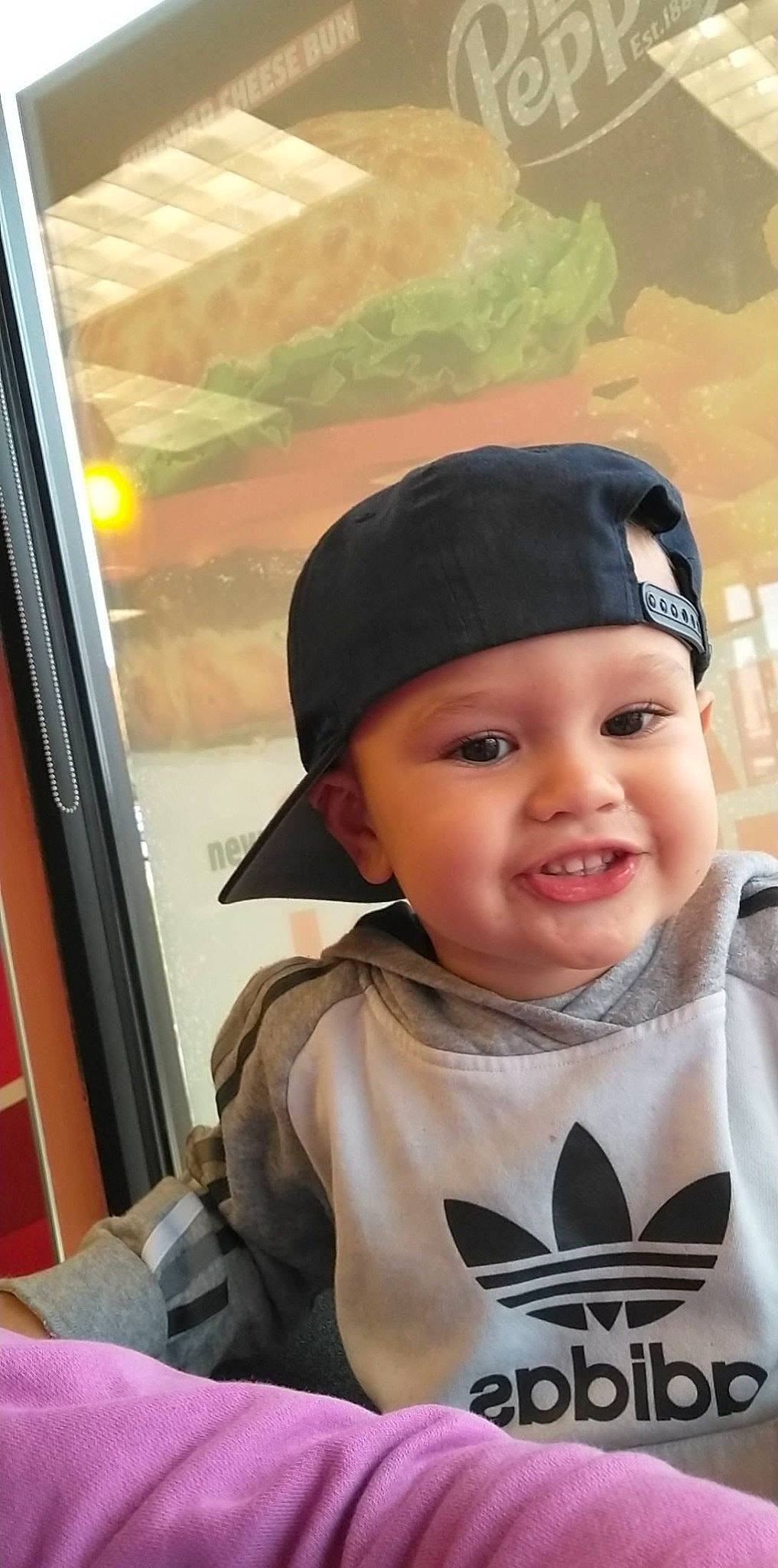 Brax is registered to the contest to win money with this photo: baby, beanie, cap, child, eye, eyebrow, fashion_accessory, flash_photography, fun, happy, headgear, headwear, joy, lip, person, personal_protective_equipment, portrait_photography, sitting, sleeve, smile