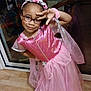 Joséphine participe au concours pour gagner de l'argent avec cette photo : celebration, child, costume, cute, fashion, fun, girl, glasses, happy, headband, indoor, person, pink_dress, playful, portrait, pose, princess, smile, wooden_floor, young