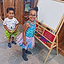 Joséphine a rejoint le concours — aidez-le/la à gagner de superbes lots ! child, children, toddler, girl, boy, dress, glasses, beads, play, education, board, alphabet, shoes, socks, floor, wooden, toy, indoor, smile, happy
