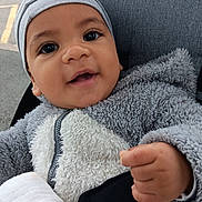 Angel participe au concours pour gagner de l'argent avec cette photo : baby, blanket, child, cute, expression, face, fuzzy_clothing, hand, happy, hat, infant, jacket, outdoor, person, portrait, road, smile, stroller, warm_clothing, young_child