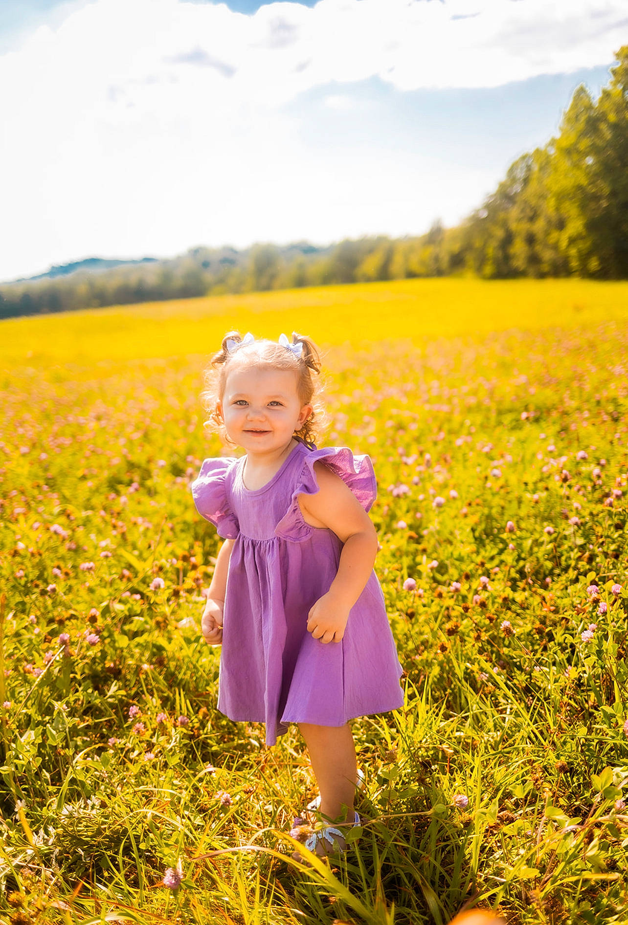 Emersyn is registered to the contest to win money with this photo: agriculture, cloud, field, flower, grass, grassland, happy, joy, landscape, meadow, natural_landscape, people_in_nature, person, plain, plant, prairie, sky, summer, sunlight, toddler