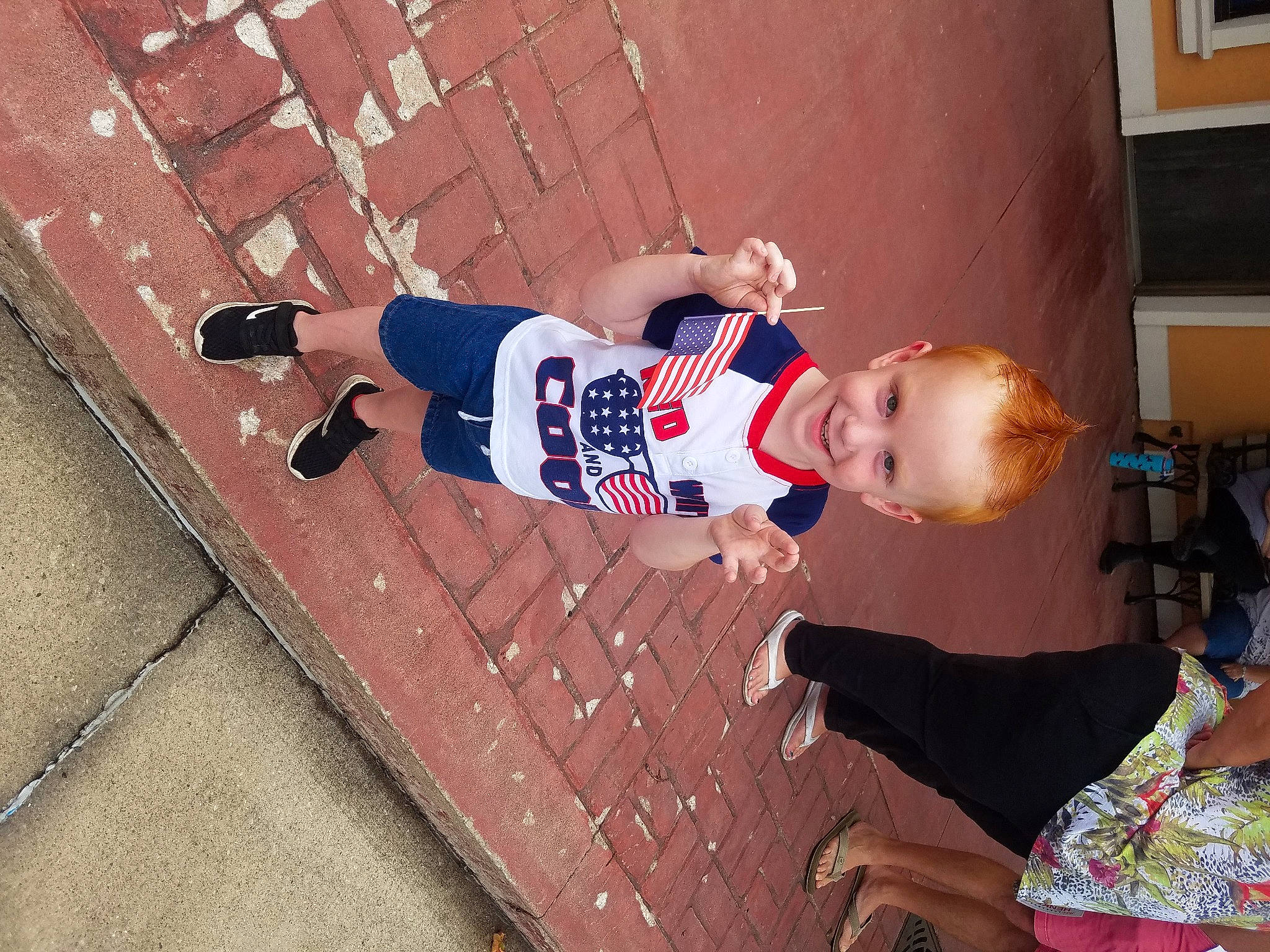 Daxton is registered to the contest to win money with this photo: baby, brick, brickwork, child, concrete, floor, flooring, fun, happy, human_leg, joy, leisure, pattern, person, picture_frame, play, room, smile, t_shirt, thigh