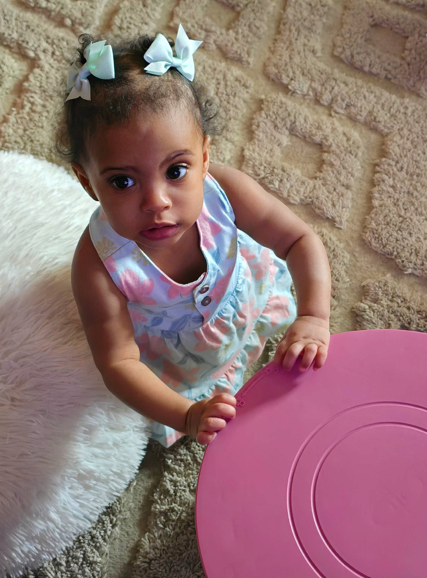 accessories, baby, bodypart, clothing, couch, cushion, dress, face, finger, frisbee, furniture, hand, hat, head, homedecor, person, photography, portrait, sitting, toy