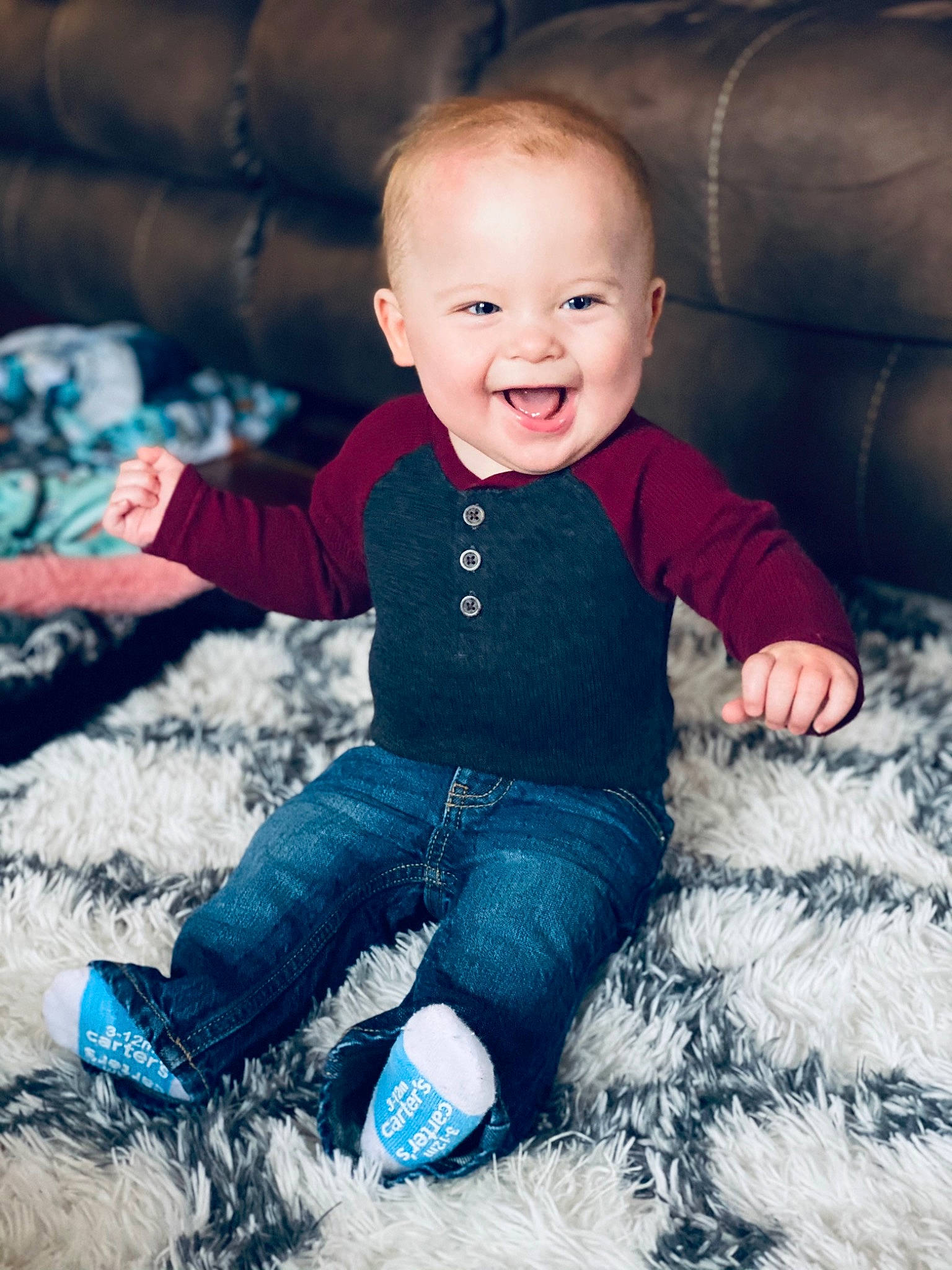 Easton is registered to the contest to win money with this photo: baby, blue, cheek, child, cloud, cool, eye, face, head, jeans, joy, people, person, photograph, photography, play, portrait_photography, sitting, skin, sleeve