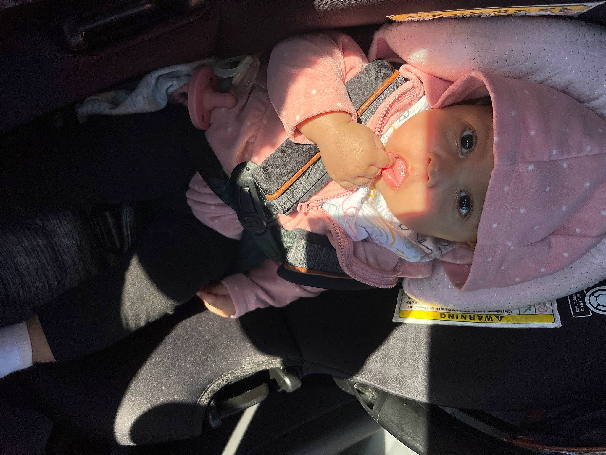 Naomi is registered to the contest to win money with this photo: auto_part, baby, baby_carriage, baby_products, baby_toddler_clothing, car_seat, child, comfort, costume, event, family_car, fashion_accessory, fun, hat, headwear, human_body, lap, luxury_vehicle, person, sitting