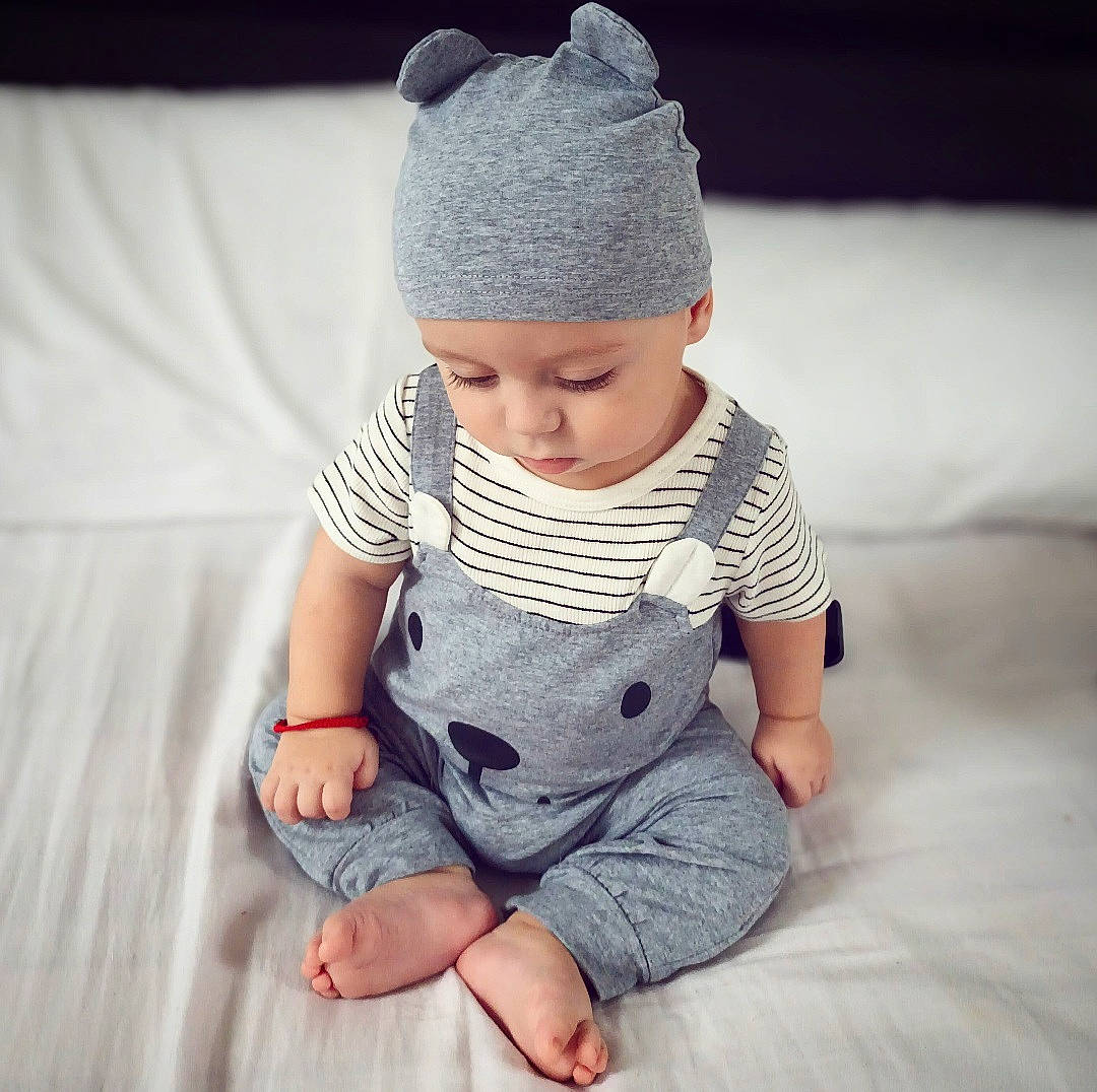 Mateo Gabriel joined the competition — help win amazing prizes! baby, baby_toddler_clothing, cap, chin, clothing, comfort, eye, face, finger, hand, head, headgear, headwear, human_body, knit_cap, leg, neck, outerwear, pattern, person