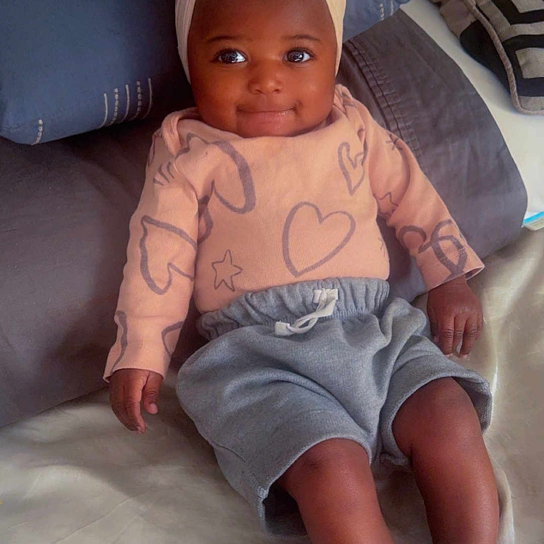 Niani joined the competition — help win amazing prizes! accessories, baby, bed, bedroom, clothing, couch, cushion, face, furniture, head, homedecor, indoors, jewelry, pants, person, photography, portrait, shorts, sitting, toy