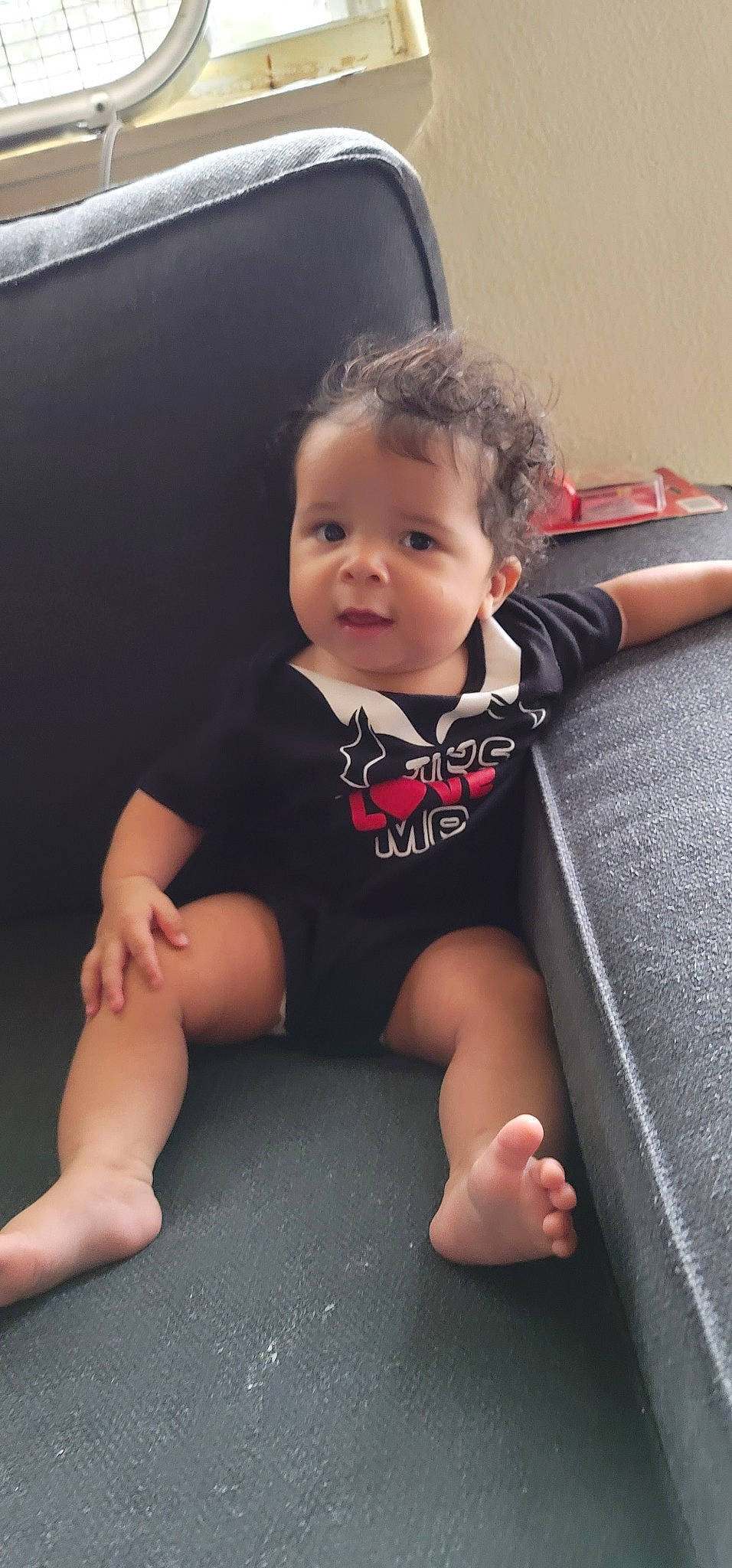 Kyro is registered to the contest to win money with this photo: arm, baby, baby_toddler_clothing, cheek, comfort, finger, floor, flooring, hand, head, human_body, iris, joint, leg, mouth, person, skin, sleeve, t_shirt, thumb