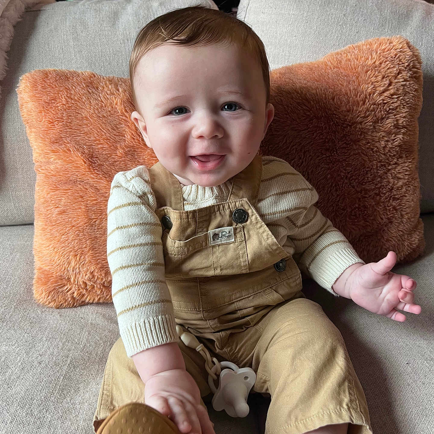 Benjamin Brooks is registered to the contest to win money with this photo: baby, bodypart, chair, clothing, couch, cushion, face, finger, footwear, furniture, hand, happy, head, homedecor, pants, person, photography, portrait, shoe, sitting