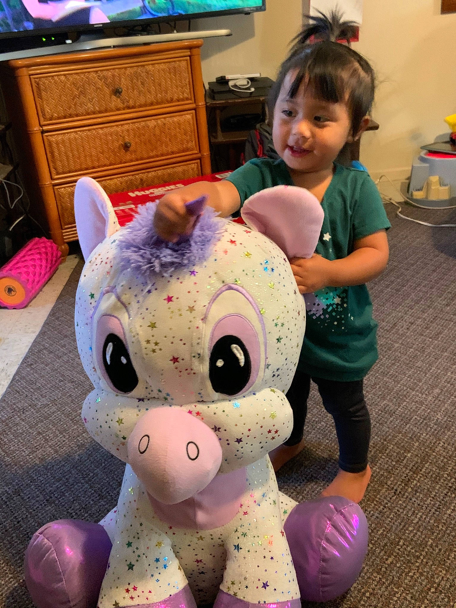 Rebel Kealohilani Sachie Shook is registered to the contest to win money with this photo: child, ear, eye, fun, games, happy, head, person, pink, play, plush, purple, smile, snapshot, snout, stuffed_toy, teddy_bear, textile, toddler, toy