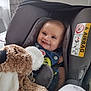 Lissandro participe au concours pour gagner de l'argent avec cette photo : baby, blanket, car_seat, child, childrens_clothing, clothing, comfort, cute, face, happy, head, indoor, infant, person, plush, safety, seatbelt, smile, stuffed_animal, toy