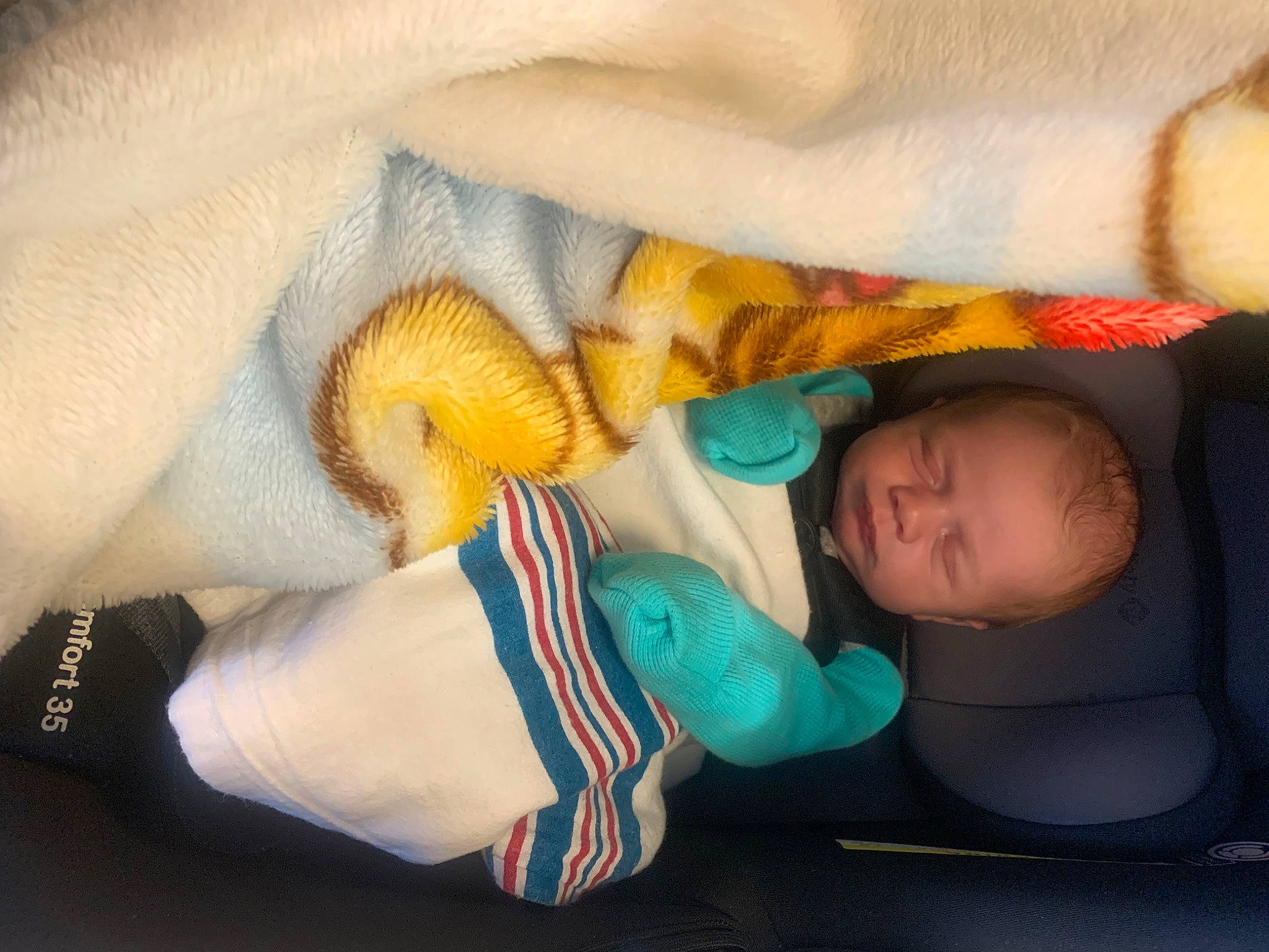Jayceon is registered to the contest to win money with this photo: arm, baby, baby_sleeping, baby_toddler_clothing, cheek, child, comfort, finger, gesture, hand, human_body, leg, mammal, mouth, nose, organ, person, skin, textile, toddler