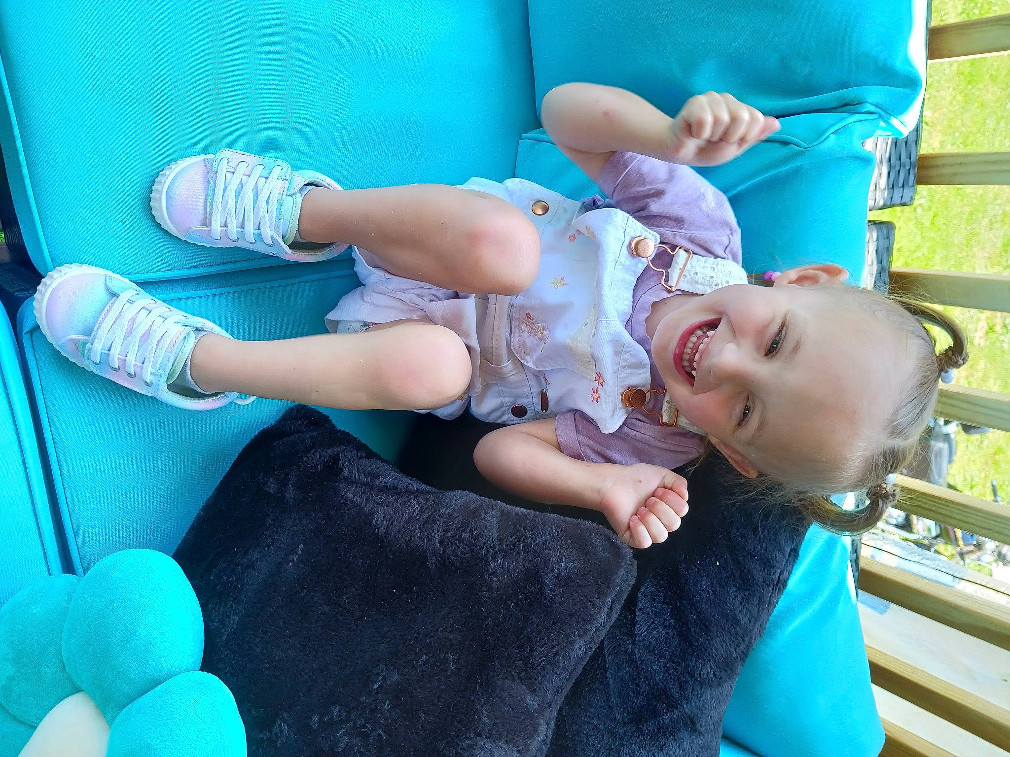 Emma is registered to the contest to win money with this photo: baby, baby_products, baby_toddler_clothing, beauty, blue, child, comfort, electric_blue, fun, grass, green, happy, joy, leisure, mammal, mouth, person, sitting, smile, thigh