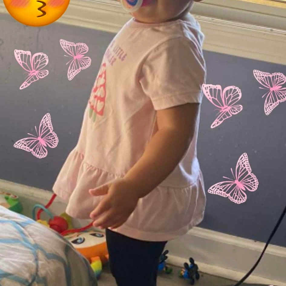 Layani is registered to the contest to win money with this photo: baby, balloon, clothing, electricaldevice, face, footwear, furniture, head, homedecor, indoors, microphone, pants, person, photography, plant, portrait, pottedplant, purple, shoe, t_shirt
