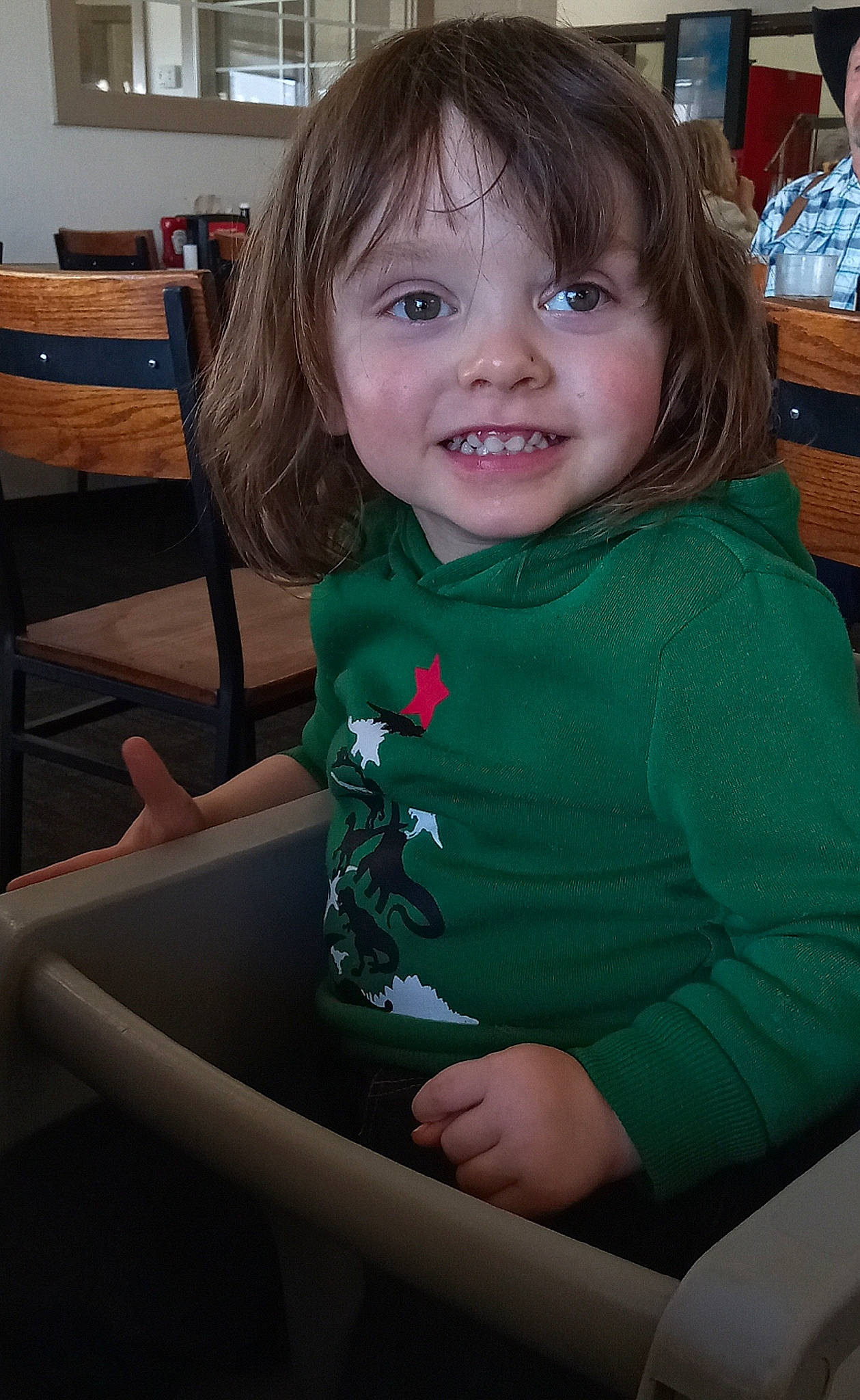 Boston joined the competition — help win amazing prizes! blond, chair, cheek, child, event, eye, fun, hair, hairstyle, happy, head, joy, lap, long_hair, person, sitting, smile, t_shirt, table, toddler