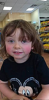 Boston is registered to the contest to win money with this photo: baby, baby_toddler_clothing, bangs, blond, brown_hair, cheek, child, convenience_store, customer, eyelash, fun, happy, joy, nose, person, retail, shelf, skin, sleeve, smile