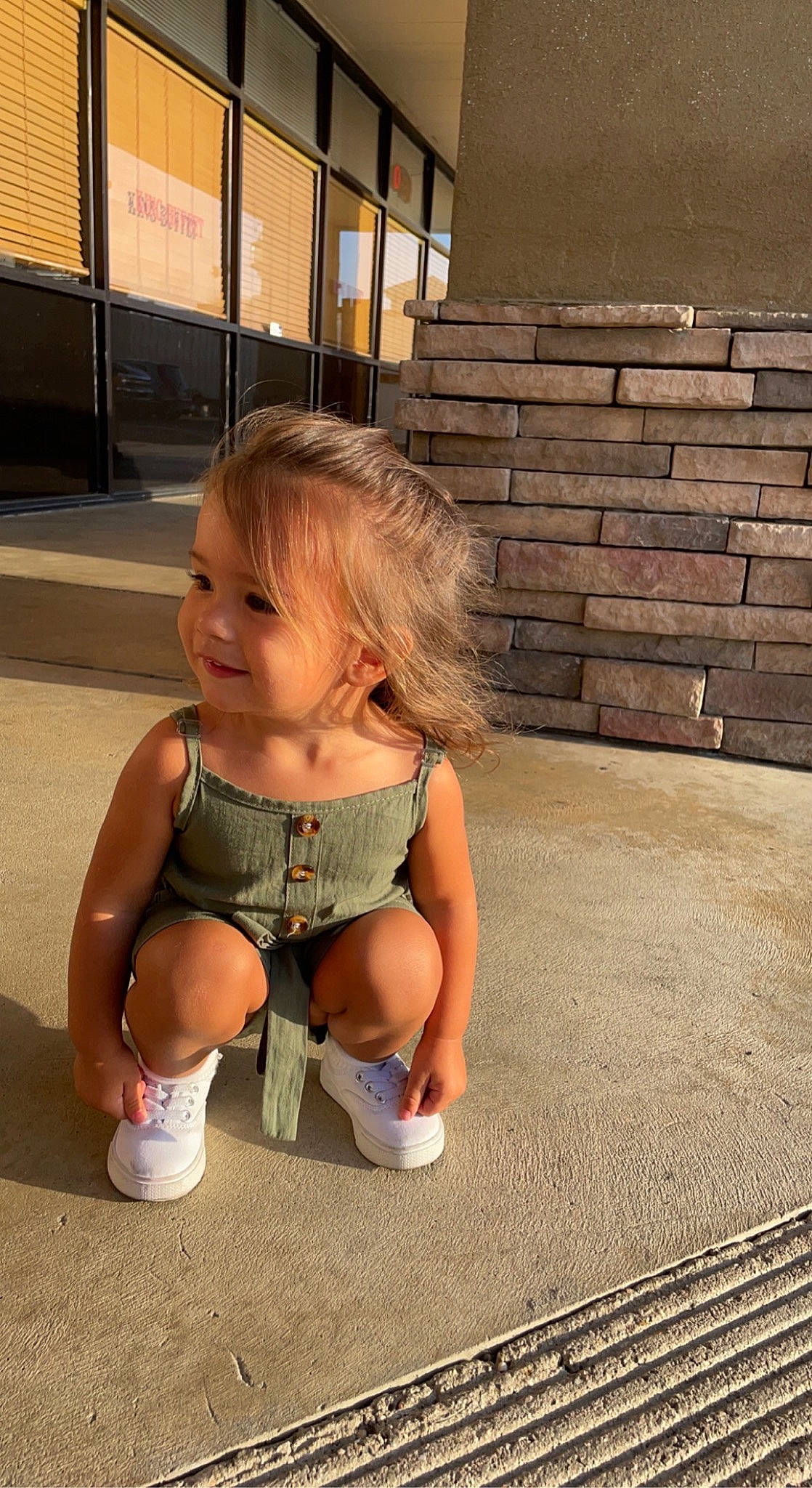 Freya joined the competition — help win amazing prizes! baby, blond, brown_hair, child, fawn, floor, flooring, foot, grass, happy, human_leg, joy, leg, leisure, person, sandal, sitting, skin, smile, thigh