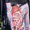 Ziva joined the competition — help win amazing prizes! newborn, baby, stroller, blanket, pink_clothing, sleeping, sunlight, floral_pattern, cherry_pattern, infant, outdoor, baby_lotion, socks, peaceful, cute, resting, soft_texture, baby_girl, closeup, child