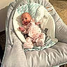 Ziva joined the competition — help win amazing prizes! baby, infant, onesie, baby_rocker, toy, smile, indoor, carpet, cushion, fabric, soft_toy, happy, child, person, home, baby_clothing, baby_furniture, seat, comfort, newborn