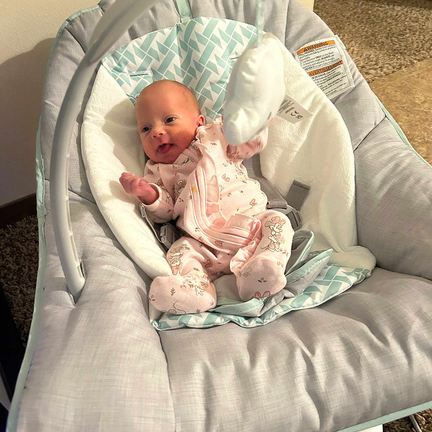 Ziva joined the competition — help win amazing prizes! baby, infant, onesie, baby_rocker, toy, smile, indoor, carpet, cushion, fabric, soft_toy, happy, child, person, home, baby_clothing, baby_furniture, seat, comfort, newborn