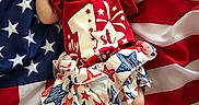Ziva joined the competition — help win amazing prizes! baby, infant, sleeping, american_flag, red_shirt, star_pattern, skirt, clothing, cute, peaceful, patriotic, fabric, stars, stripes, person, portrait, newborn, resting, soft, celebration