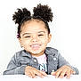 Aurora joined the competition — help win amazing prizes! child, girl, smiling, curly_hair, pigtails, beads, earrings, gray_jacket, pink_shirt, hands, white_background, portrait, happy, cute, fashion, youth, face, teeth, playful, studio