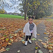 Aurora joined the competition — help win amazing prizes! child, girl, autumn, fall_leaves, park, pathway, tree, grass, jacket, boots, smiling, outdoor, nature, seasonal, hair, pigtails, beads, casual_clothing, daylight, scenic