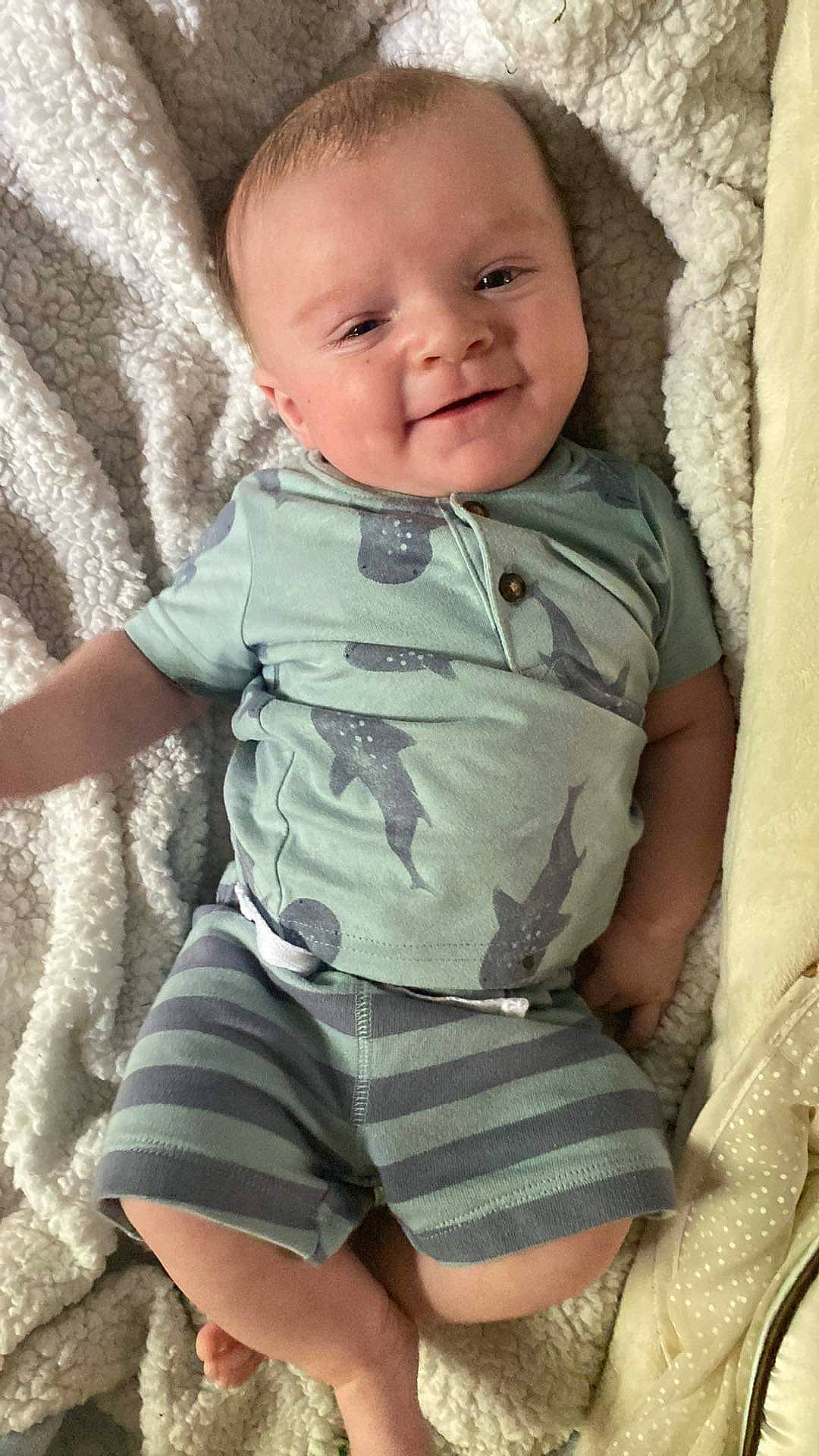 Tyler is registered to the contest to win money with this photo: arm, baby_toddler_clothing, cheek, chin, eye, eyebrow, hair, hand, head, human_body, joint, lip, mouth, neck, nose, person, shoulder, skin, sleeve, smile