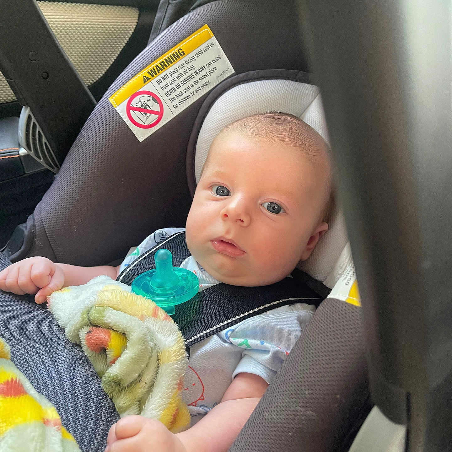 Oliver joined the competition — help win amazing prizes! baby, blanket, blue_eyes, car, car_seat, child, clothing, cute, face, hand, head, indoor, infant, newborn, pacifier, portrait, safety, seatbelt, transportation, warning_label