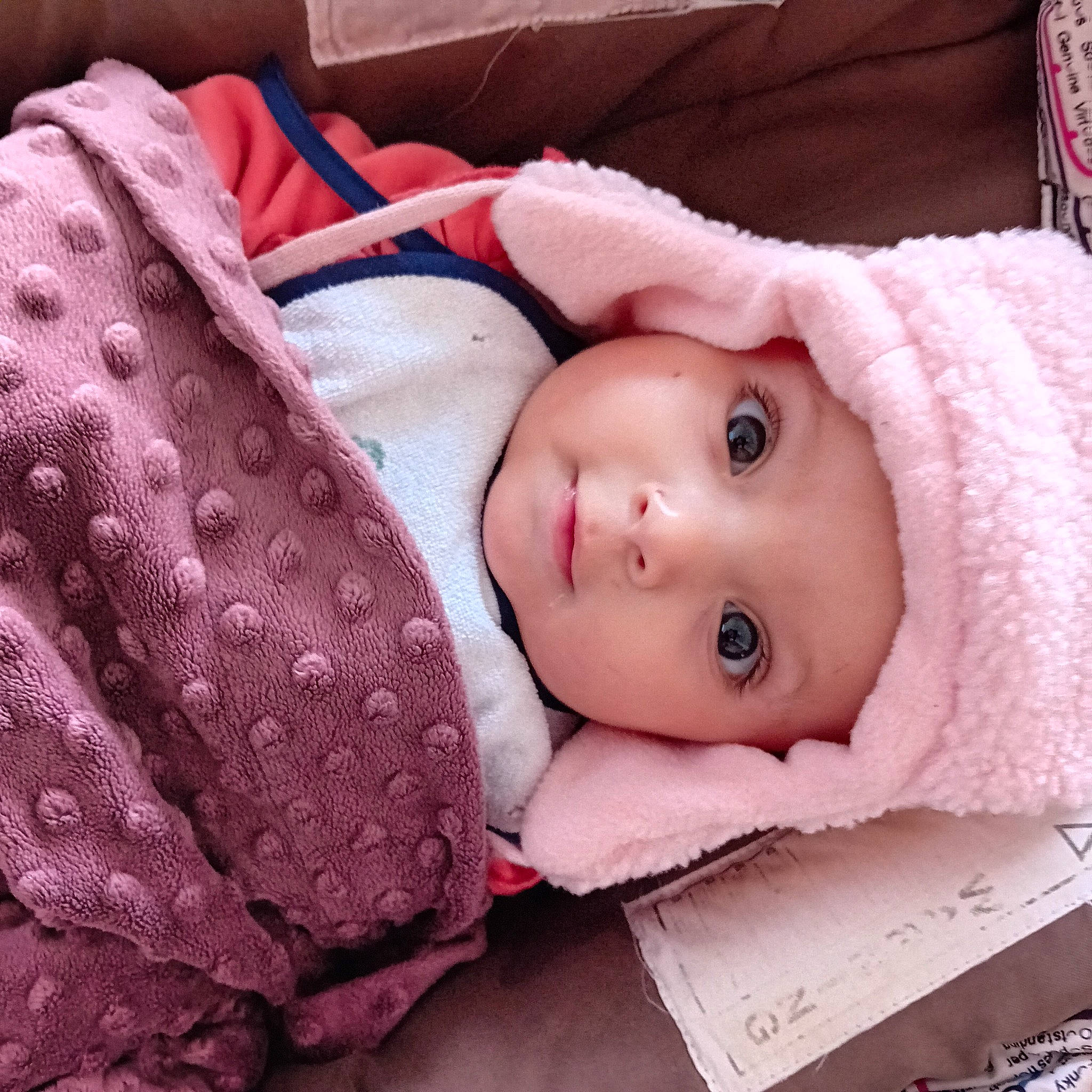 Djenah participe au concours pour gagner de l'argent avec cette photo : baby, baby_toddler_clothing, cheek, child, comfort, eye, eyelash, fur, head, headwear, iris, knit_cap, linens, lip, magenta, pattern, person, pink, skin, sleeve