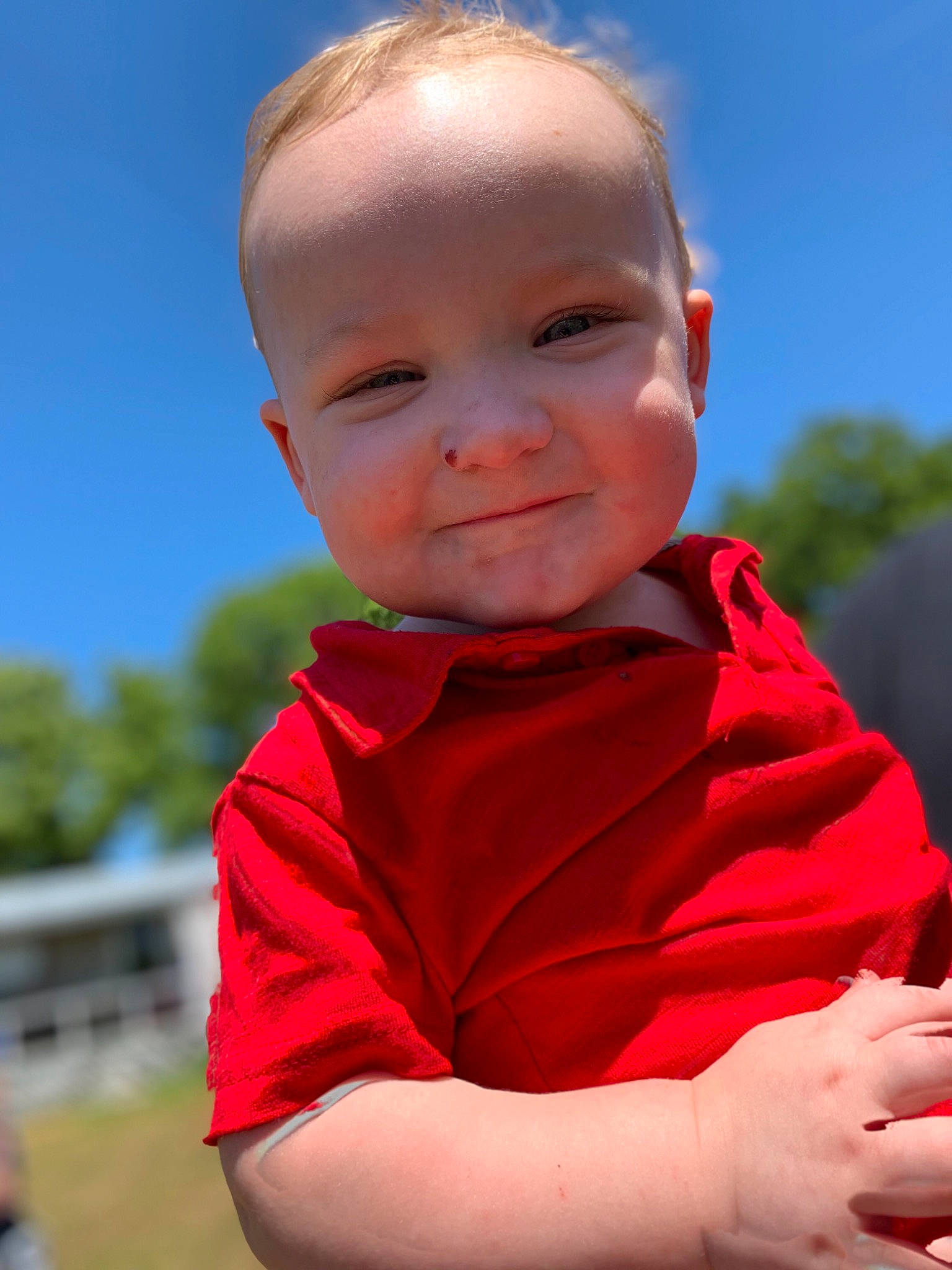 Leroy is registered to the contest to win money with this photo: baby, cheek, child, face, grass, happy, head, joy, lip, person, photography, red, skin, sky, smile, toddler, vacation