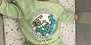 Trent joined the competition — help win amazing prizes! baby, child, comfort, cozy, crib, cute, face, green_clothing, happy, indoors, infant, laying_down, moon_pattern, pajamas, person, sleeping_area, smiling, socks, soft_toys, stars_pattern