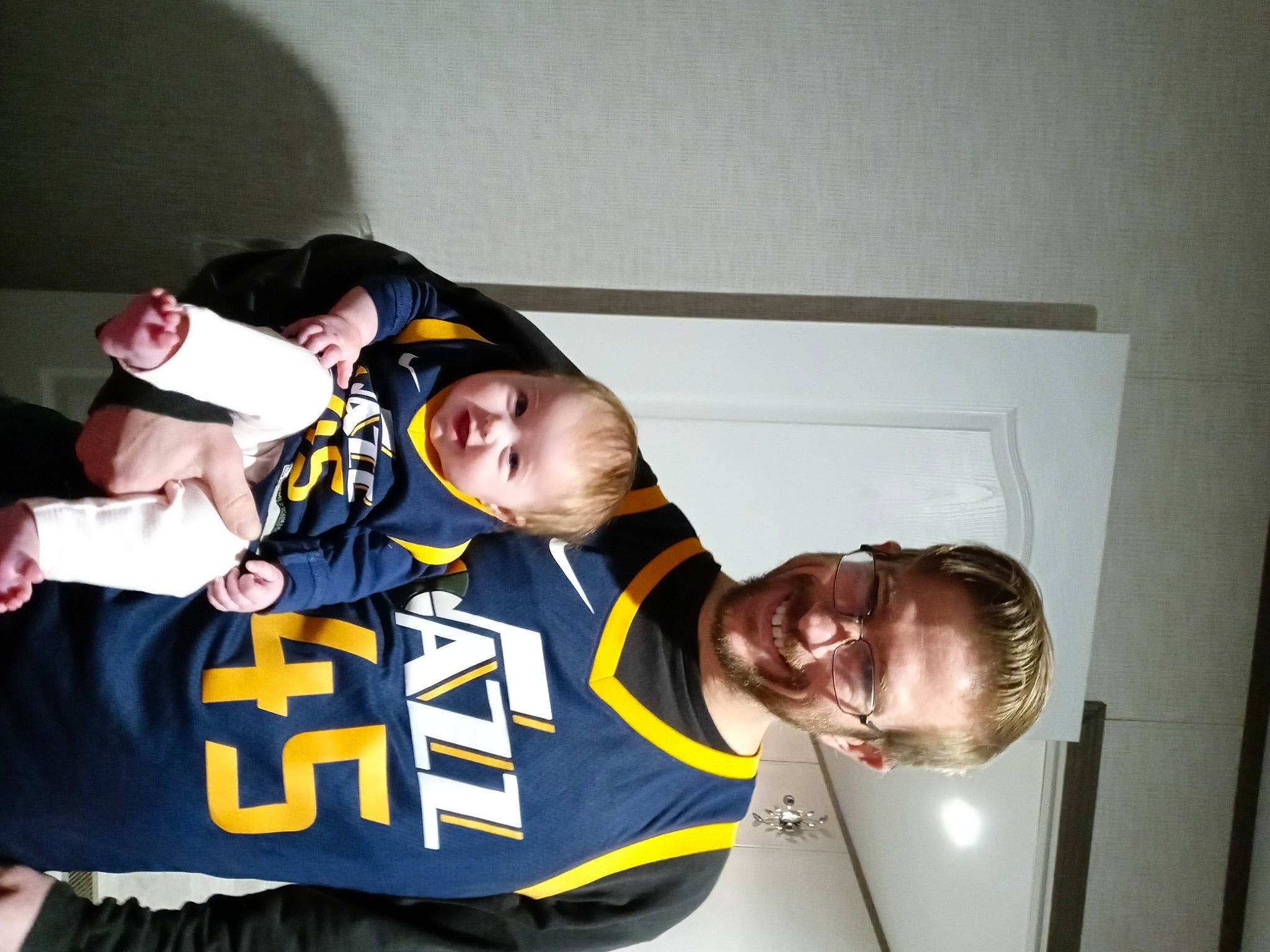 Hazel is registered to the contest to win money with this photo: elbow, eyewear, font, fun, gesture, happy, jersey, joy, logo, person, personal_protective_equipment, player, room, sleeve, smile, sports_jersey, sports_uniform, sportswear, t_shirt, team