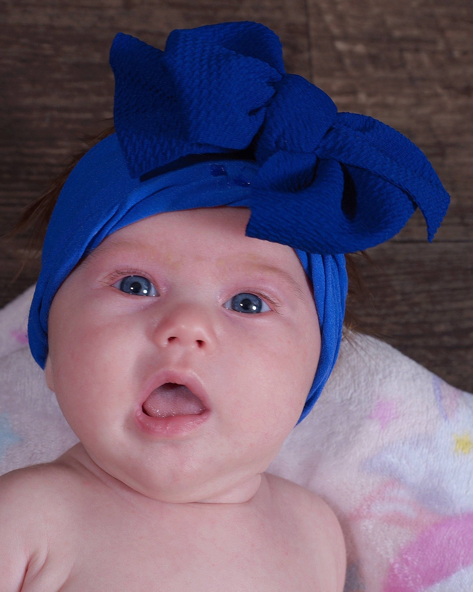 Hazel is registered to the contest to win money with this photo: azure, baby, baby_toddler_clothing, blue, cap, cheek, child, chin, electric_blue, eyelash, face, hair_accessory, happy, hat, headwear, lip, person, pink, skin, smile