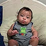 Niko joined the competition — help win amazing prizes! baby, infant, child, onesie, striped_clothing, frog, embroidered, sitting, pillow, bed, curly_hair, cute, indoors, person, face, eyes, hands, legs, white_socks, expression