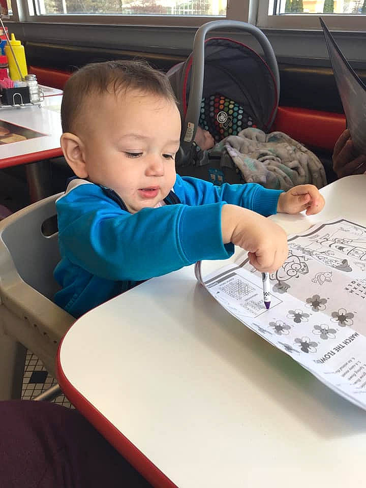 Keyonte joined the competition — help win amazing prizes! baby, car, car_seat, child, hand, learning, person, play, reading, sitting, toddler, vacation, vehicle