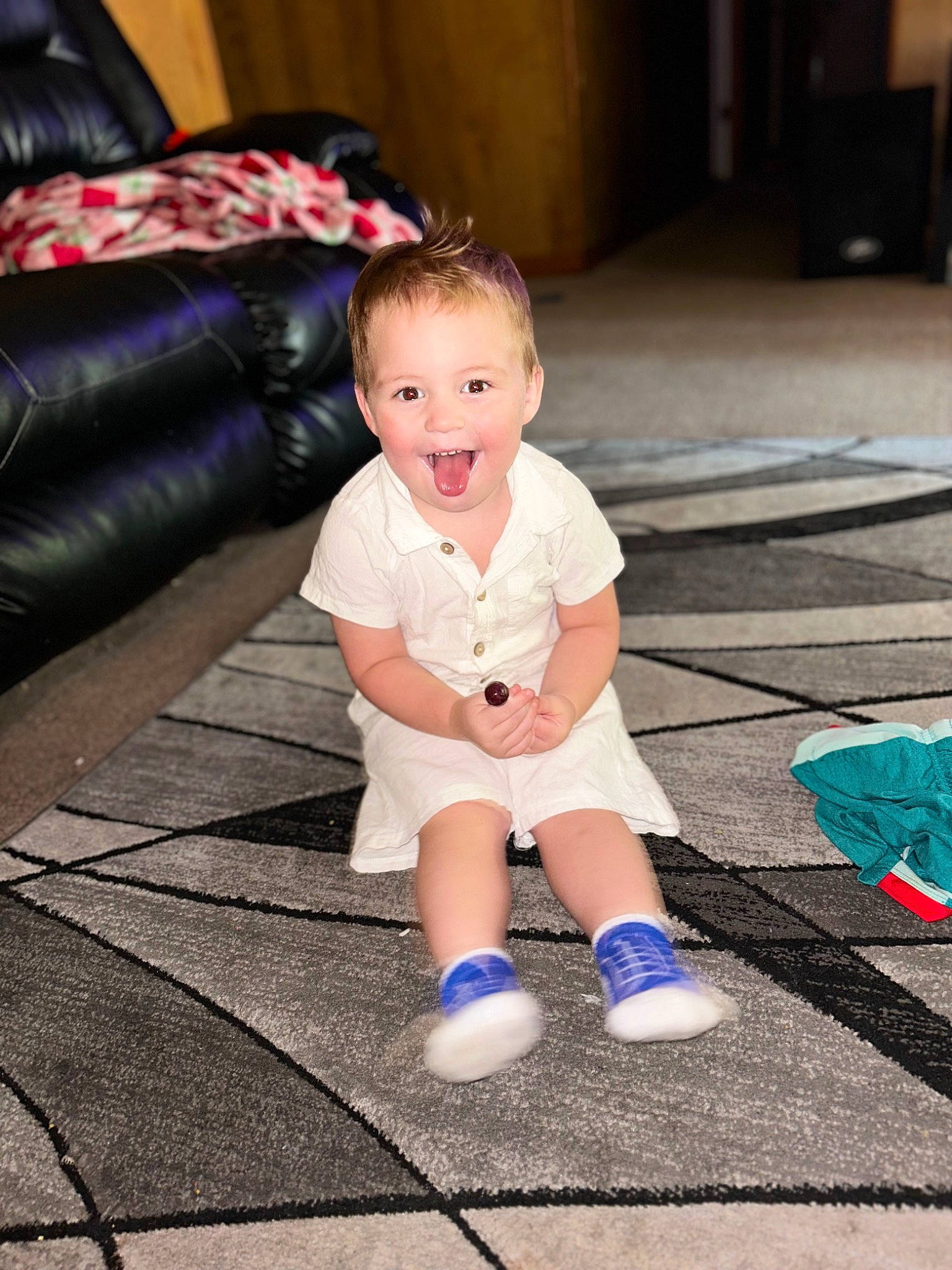 Koda joined the competition — help win amazing prizes! baby, baby_toddler_clothing, child, comfort, couch, electric_blue, floor, flooring, foot, fun, happy, head, human_body, human_leg, leg, leisure, person, pink, sitting, smile