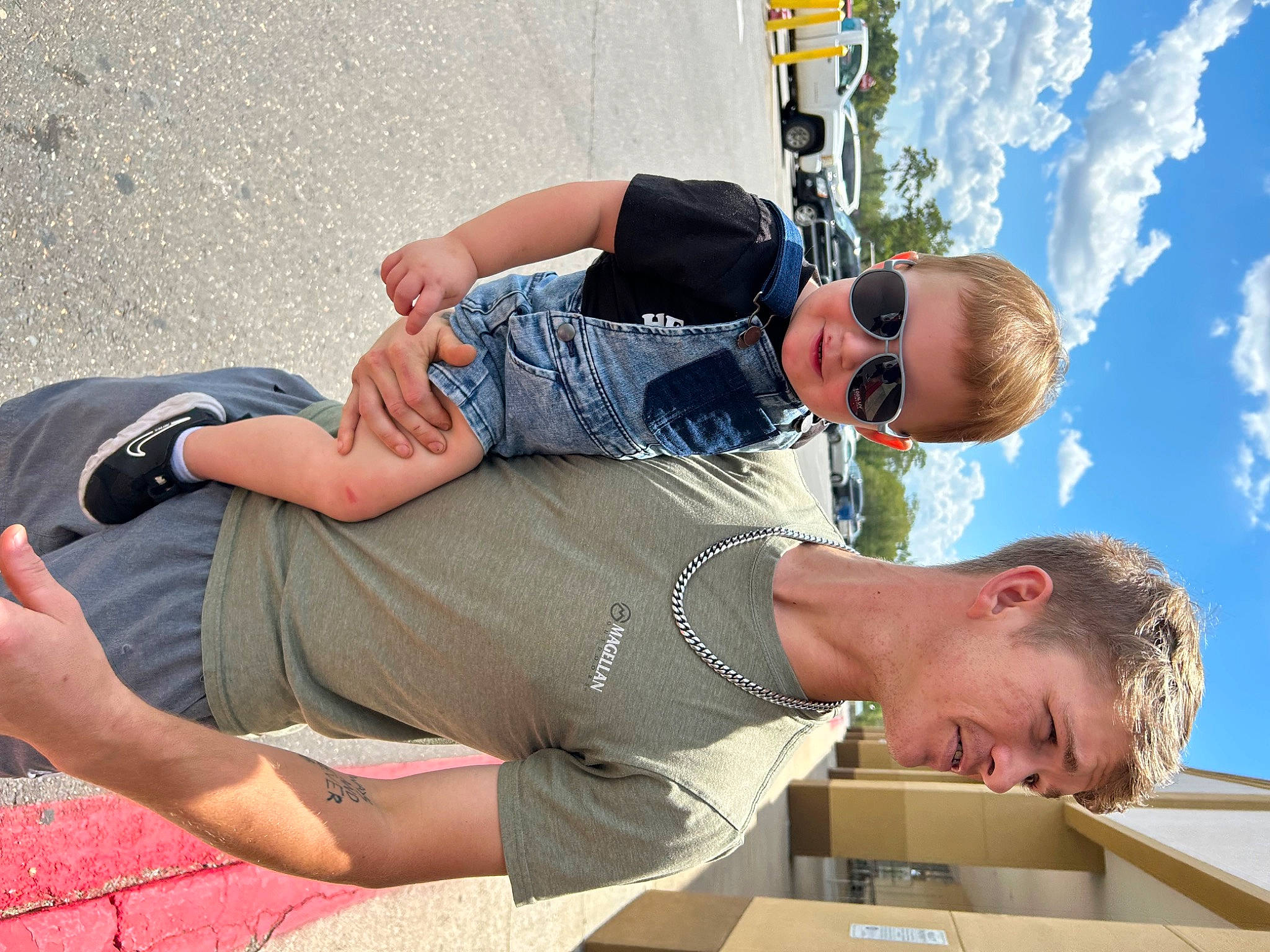 Koda joined the competition — help win amazing prizes! blue, cloud, elbow, eyewear, foot, fun, gesture, goggles, happy, hat, human_leg, knee, leisure, person, recreation, shorts, sky, sunglasses, thigh, travel