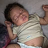 Kehlani joined the competition — help win amazing prizes! baby, infant, sleeping, portrait, bed, bedding, indoors, lying_down, curly_hair, closed_eyes, peaceful, onesie, diaper, arms_raised, hands, barefoot, skin, nap, bedroom, gerber