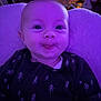 Rue joined the competition — help win amazing prizes! baby, infant, face, tongue, purple_light, clothing, pattern, tree_pattern, cushion, soft_texture, indoor, portrait, smiling, happy, child, young, cute, cozy, closeup, person