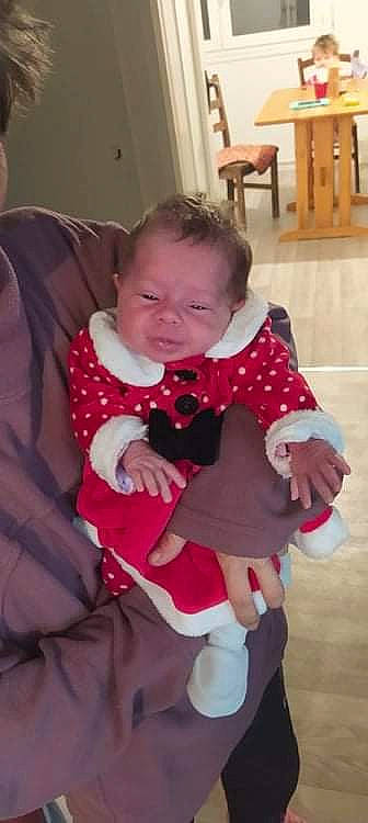 Azzallya participe au concours pour gagner de l'argent avec cette photo : baby, baby_toddler_clothing, blurred, cheek, child, comfort, finger, flooring, fun, hardwood, human_leg, lap, magenta, person, pink, sitting, sleeve, sock, thigh, toddler