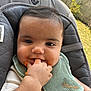 Maël a rejoint le concours — aidez-le/la à gagner de superbes lots ! baby, infant, messy, food, bib, hand, face, cheeks, seat, outdoor, grass, clothing, cute, child, person, feeding, smiling, skin, young, mess
