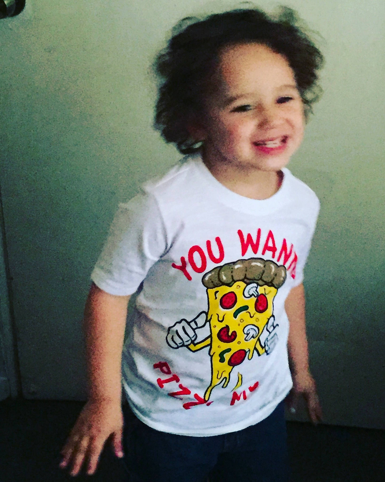 Elijah is registered to the contest to win money with this photo: child, clothing, cool, joy, neck, person, sleeve, smile, t_shirt, top