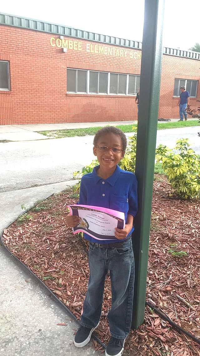 Jayden is registered to the contest to win money with this photo: adaptation, child, compost, joy, leaf, person, plant, reading, soil, tree