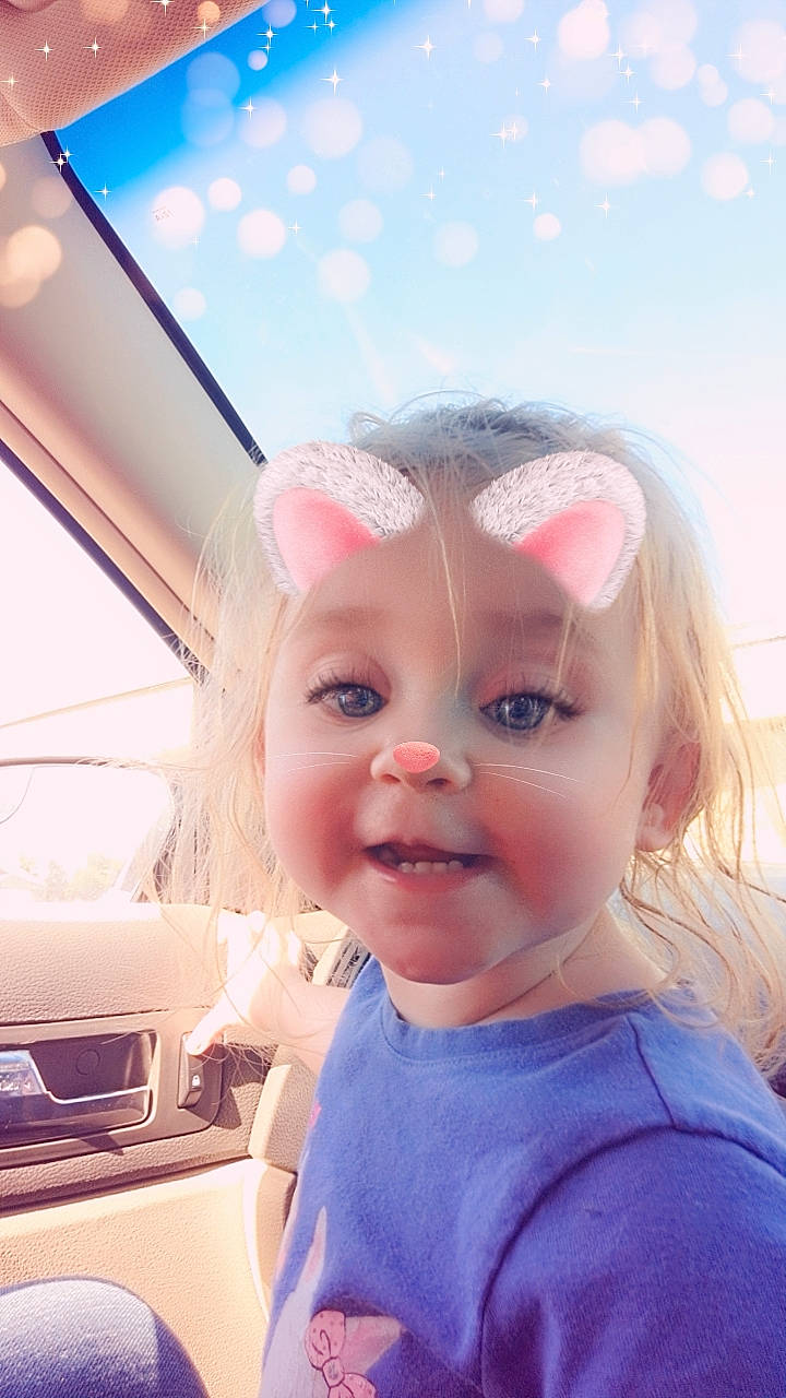 Lillian joined the competition — help win amazing prizes! automotive_exterior, automotive_lighting, bumper, car, child, cloud, cool, electric_blue, eyelash, family_car, fun, happy, hood, motor_vehicle, person, skin, sky, toddler, travel, vehicle_door