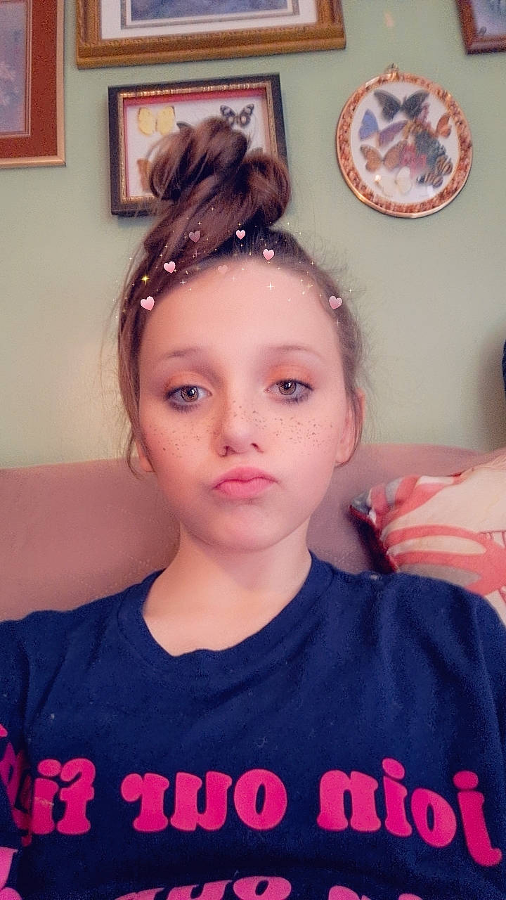 Abbigail is registered to the contest to win money with this photo: brown_hair, cheek, child, ear, electric_blue, eyelash, eyewear, fashion_accessory, forehead, fun, hair_accessory, happy, headband, headpiece, long_hair, person, picture_frame, pink, sunglasses, t_shirt