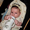 Kalinsa participe au concours pour gagner de l'argent avec cette photo : baby, bottle, headband, blanket, stroller, infant, hand, face, person, clothing, cute, child, indoors, portrait, feeding, baby_bottle, newborn, soft_lighting, resting, expression